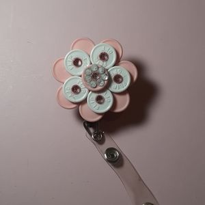 Retractable name badge holder